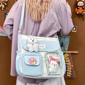 Cute polka dot canvas shoulder bag with multi pockets and clear window for students.