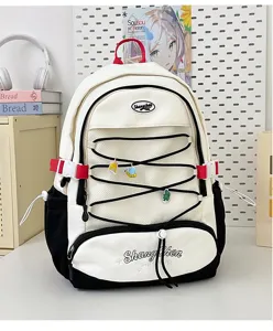 Zaino scolastico carino di grande capacità in stile giapponese per ragazze con tasche e ciondoli