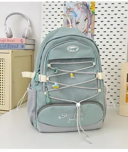 Zaino in stile giapponese carino per ragazze, grande borsa scolastica con rete e spille.