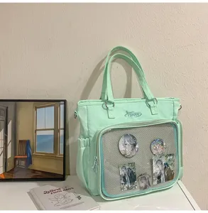 Borsa tote Ita verde chiaro multiuso in tela con tasca frontale trasparente per spille.