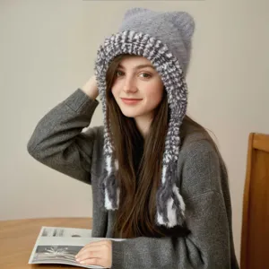Detailed view of the cute cat ear knitted winter warm braided plush earflap hat in gray.