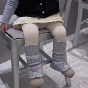 Grey knitted leg warmers detail shot showing cozy texture and warm winter style for kids daily wear.