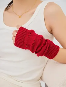 Red knit arm warmer hollow heart pattern fingerless sleeve winter cozy knitwear detail