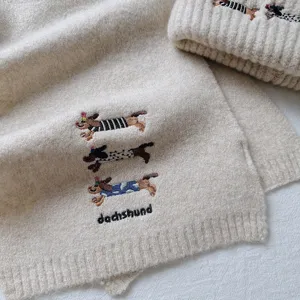 Cute dachshund embroidered wool blend knit scarf and hat detail, autumn winter warm.