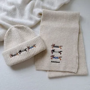 Cute dachshund embroidery knitted scarf and beanie set detail, soft warm winter wool blend.