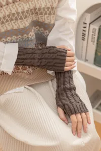 Brown cable knit fingerless gloves detail shot, warm woolen winter arm warmers for daily wear.