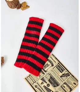 Red and black striped knitted arm warmers, cozy winter fingerless gloves, stylish.