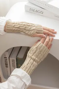 Beige cable knit fingerless gloves detail view, stylish warm half-finger gloves for winter.