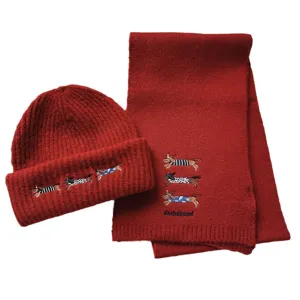 Red knitted winter beanie hat and scarf set with cute dachshund embroidery, warm daily wear.