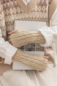 Cozy cable knit fingerless gloves for women and men, stylish winter warm arm warmers.
