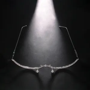 Rhinestone rimless decorative glasses frame detail showcasing sparkling crystal drops for party fashion.