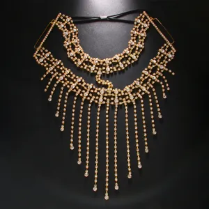Close-up detail of glittering gold rhinestone tassel face chain mask, sparkling crystal accents.
