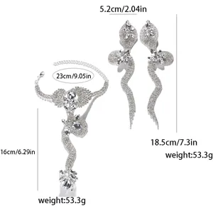 Extravagantes Strass Schlangen Ohrringe und verlinktes Finger Armband Set für Bühne.