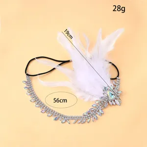 Detailed view of the 1920s vintage feather and rhinestone headband, showing crystal sparkle.