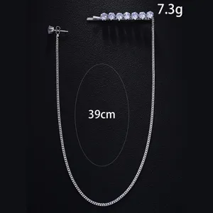 Detail view of the elegant rhinestone tassel hair clip and chain earring, sparkly crystal stones.