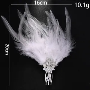 Detailed close-up view of elegant white feather rhinestone hair comb for wedding party.