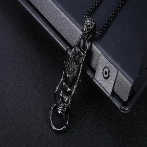 Close-up detail of mens retro titanium steel dragon pendant necklace with vintage black silver finish.