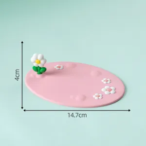 Detailed view of the cute pink daisy decorative mat, mini desktop ornament with 3D floral accent.