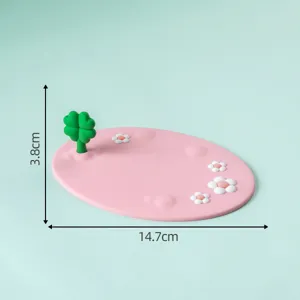 Pink non-slip mat with cute clover and daisy flowers for desktop or car console decor.
