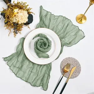 Sage green gauze table runner and napkin set for rustic bohemian wedding party table decor.