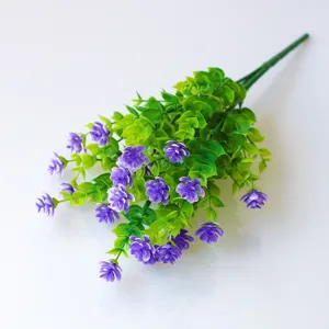 Artificial eucalyptus leaves and small purple flowers bunch for home and wall garden decor.