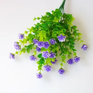 Detailed view of artificial purple flowers and green leaves, perfect for wall and home decor.