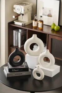 Detailed view of Nordic ceramic donut vase set, modern minimalist circle aesthetic decor.