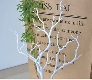 Detailed close-up of white artificial branch decor, perfect for home styling and display.