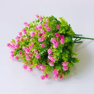 Artificial green plant bouquet with pink flowers for home garden wall decoration and floral craft.