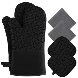 Detail view of black silicone heat resistant oven mitts and pot holders set with anti slip texture.