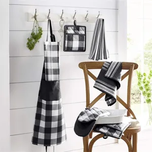 Black white buffalo plaid kitchen textile set detail, cotton oven mitts, potholders, apron.