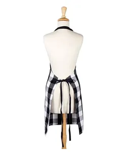Black and white buffalo plaid kitchen apron with adjustable ties, perfect for cooking.