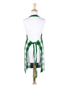 Green and white plaid kitchen apron back view detail showing adjustable neck and waist ties.