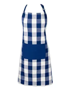 Blue and white gingham check detail of kitchen apron with front storage pocket and metal buckle.