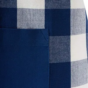 Blue and white checkered apron pocket detail, close-up fabric texture and stitching.