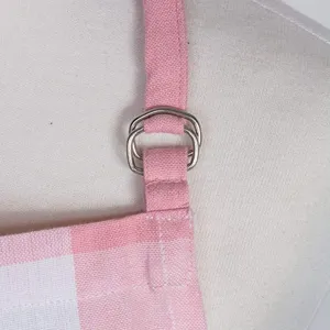 Kitchen apron strap detail, pink and white plaid linen fabric with metal adjusting ring.
