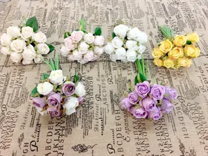Close-up detail of artificial rose bouquets, multi-color silk flowers for photography props.