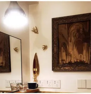 Gold flying bird wall hanging scene detail showing luxury retro home decor style effect.