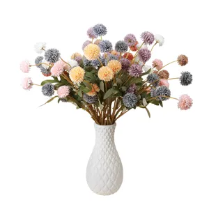 Artificial autumn pompon chrysanthemum flower bouquet with white vase for home decor.