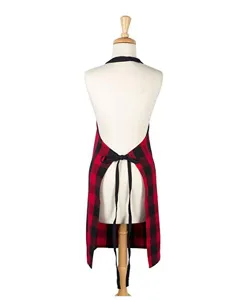 Red and black buffalo plaid kitchen apron with black straps, detail view for cooking and dining.