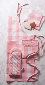 Pink white checkered kitchen apron oven mitt pot holder baking textile set detail view