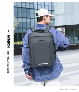 Detailed view of the multi-functional business laptop backpack in dark grey, worn outdoors.