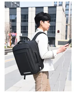 Waterproof business backpack with USB charging port, ideal for travel, work and daily commute.