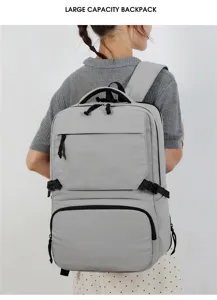 Detailed view of the large capacity grey backpack showing durable zippers and straps.