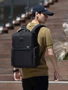 Stylish black business laptop backpack for men, large capacity and lightweight daily use.