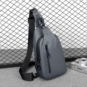 Men's grey waterproof sling bag for outdoor travel, stylish casual chest crossbody bag.