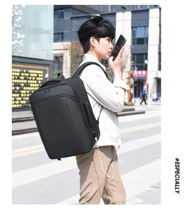 Close-up detail of the multifunctional men's business laptop backpack worn outdoors.