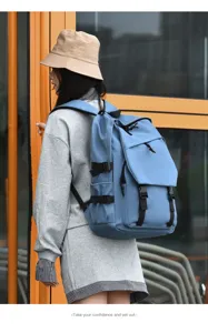 Casual blue backpack for travel and school, large capacity student computer bag with multiple pockets.
