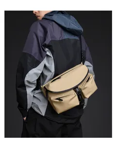 Waterproof men messenger bag detail view, casual outdoor sling chest bag for daily travel.