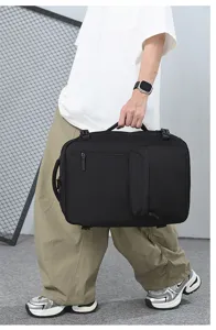 Detail view of black travel backpack with multiple compartments and durable zippers for business trips.
